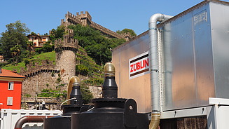 Activated carbon air filter in the foreground, beautiful old town in the background