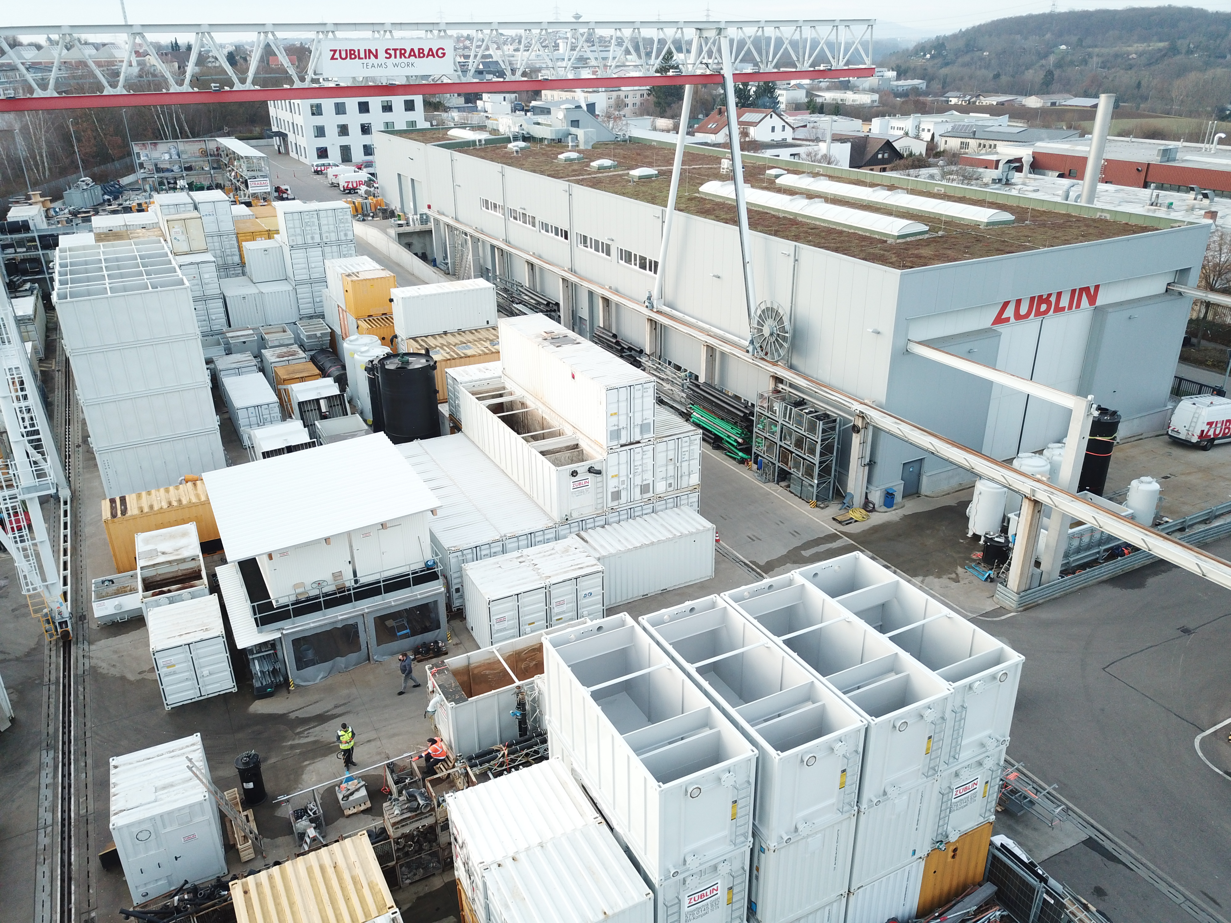 Aerial view with settling basin in the foreground and large storage area in the background